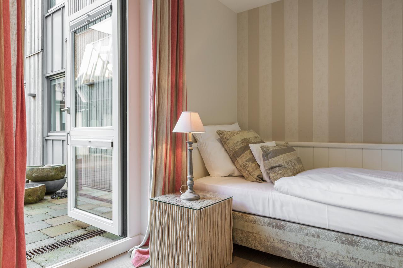Apartmenthotel Am Leuchtturm Хёрнум Экстерьер фото