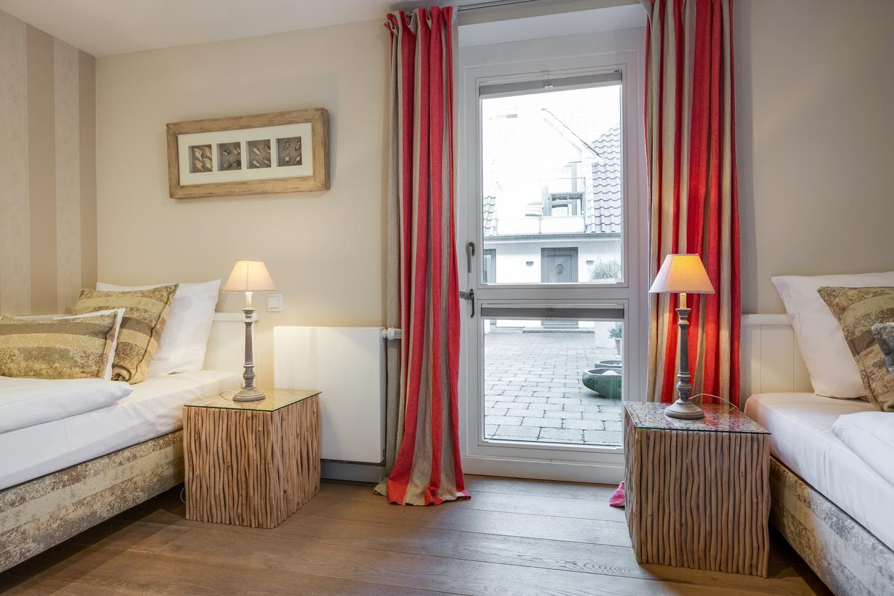 Apartmenthotel Am Leuchtturm Хёрнум Экстерьер фото
